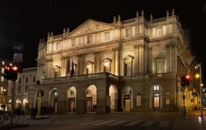Elegant evening arrival at Teatro alla Scala opera house in Milan