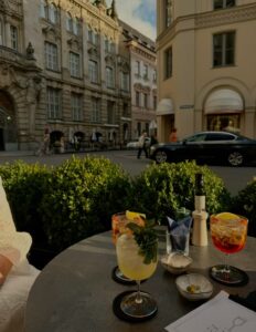 enjoying drinks at a terrace in summer in Munich during the opera festival